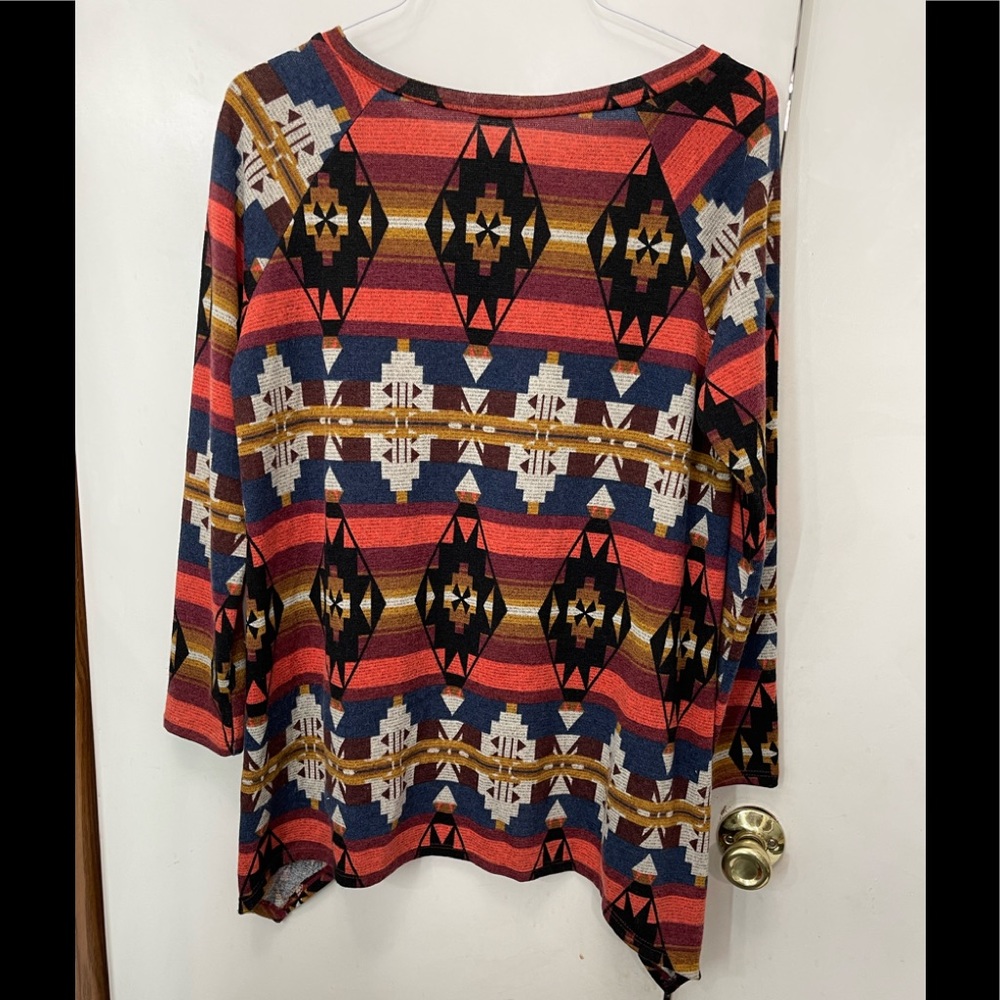 Cute Aztec print, shark bite tunic.  Orange, blue, tan, and cream.  Long sleeve